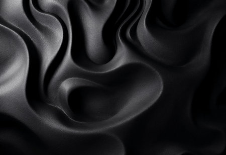 Soft, flowing black fabric displays intricate waves and folds, capturing light and shadow in a dance of texture and elegance, suitable for artistic or design inspiration.の素材
