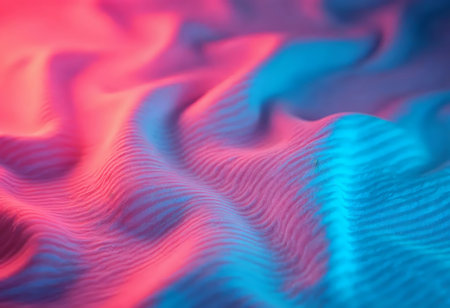 Soft fabric cascades in vibrant hues of pink and blue, forming gentle waves that shimmer under light. This tranquil display evokes calm and creativity, inviting exploration and wonder.の素材