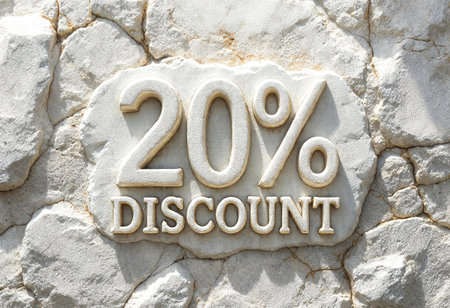 A decorative sign carved into a textured stone wall showcases a twenty percent discount offer, emphasizing savings and attracting potential customers with its clear messaging.の素材