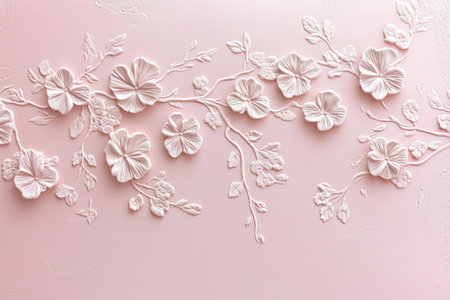 A stunning arrangement of intricately designed flowers and branches emerges from a soft pink backdrop. The relief art captures beauty and elegance, inviting admiration and reflection.の素材