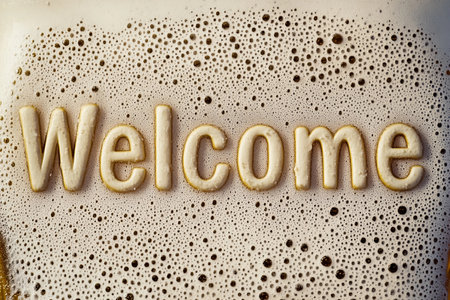 A warm and inviting message appears in bright foam, welcoming guests to a delightful gathering. The bubble-covered surface adds a playful touch to the atmosphere, suggesting comfort and friendliness.の素材