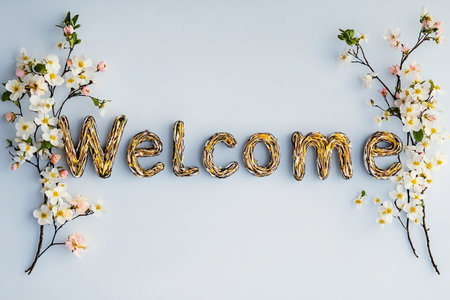 An inviting arrangement of spring flowers intricately shapes the word Welcome. Set against a gentle background, it radiates warmth and joy, perfect for greeting guests anytime.の素材