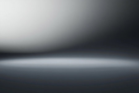 A smooth gradient of gray fills the backdrop, evoking calmness and elegance. The subtle transition from light to dark offers a perfect canvas for creative expression and design projects.の素材