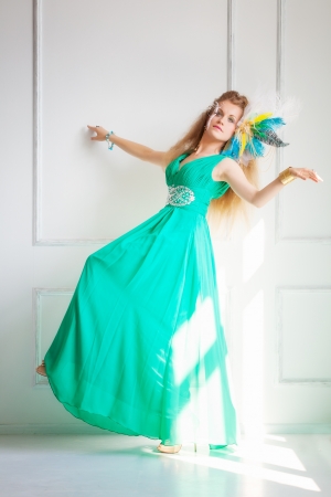 Woman-bird in green dress. Studio shotの写真素材