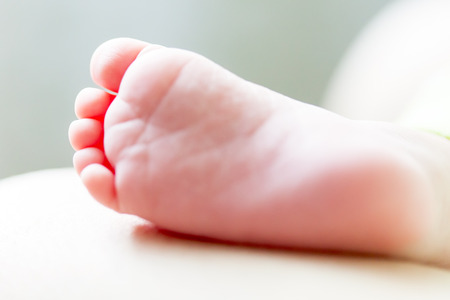 The right foot of a newborn baby