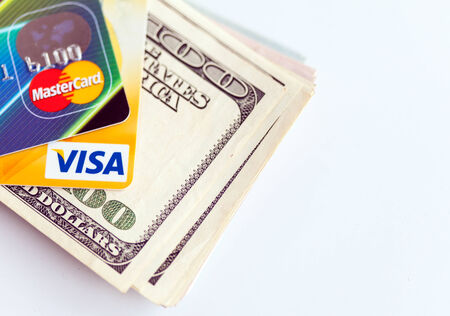 RUSSIA, OREL - 28 NOVEMBER 2014: Two credit cards by Mastercard and Visa and dollar billsのeditorial素材