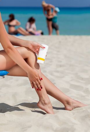 Sun protection for the legs on the beachの写真素材