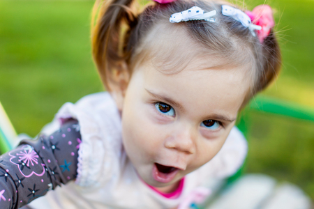 Little girl is making selfie in the parkの写真素材