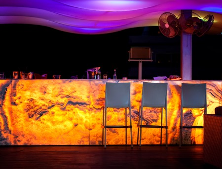 CYPRUS, PROTARAS, STREET BAR - OCTOBER 14, 2016: Bar rack in street bar at night Protarasのeditorial素材