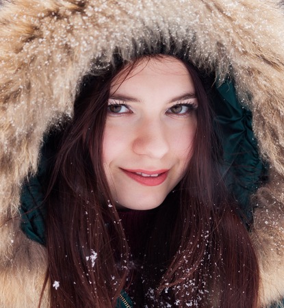 Portrait of a girl in a winter parkの写真素材