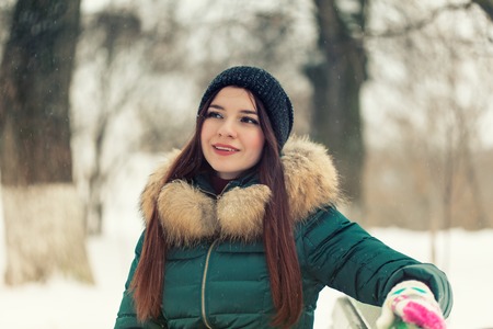 Portrait of a girl in a winter parkの写真素材