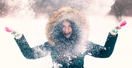 Portrait of a girl in a winter parkの写真素材