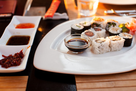 Plate with sushi rolls in the restaurantの写真素材