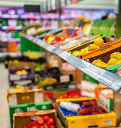 Fruits and vegetables on the shelves at a supermarketのeditorial素材