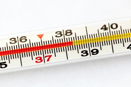 Thermometer with high temperature of body on white background.の写真素材
