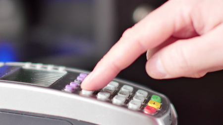 Paying with a credit card on a POS terminal.の写真素材