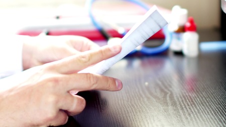 Doctor reading medical documents for medical researchの写真素材