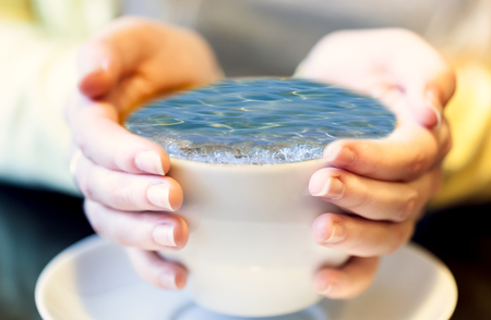 Sea surf in a cup of coffee