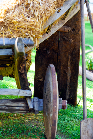 Old vintage cart with yellow strawの写真素材