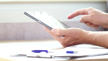 Man using modern digital youchscreen tablet computer