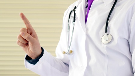 Doctor make no sign by his finger. He shows forbidden sign for medecineの写真素材