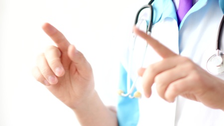 Male doctor gesturing and explaining something for patient.の写真素材