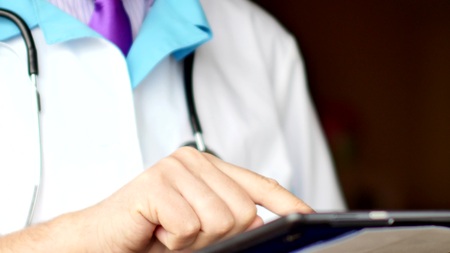 Medical doctor using modern touchscreen digital tabletの写真素材