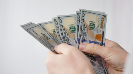 Man counting US dollars close-up. Business, big money of success conceptの写真素材