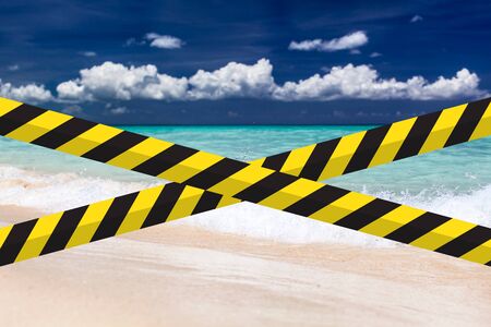Empty beach with warning tape. COVID 19. Coronavirus protection. Lockdown Quarantine, closed beaches. Keep social distance. Touristic Season Failure.の写真素材