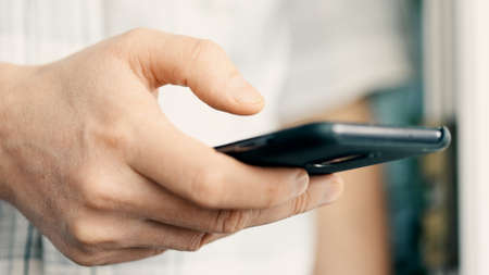 Close up shot of business men hand using smart phone