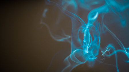Artistic and relaxing isolated close up incense smoke movement indoors with beautiful bokeh...
