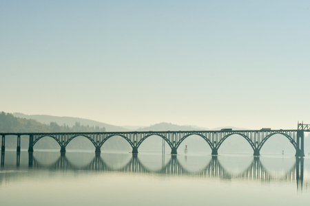 A bridge over the Coos River bay at its mouth next to the Oregon Dunesの写真素材