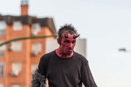 People masquerading as demons frightening people on the occasion of the feast of St. George.