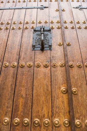 Detail of the knocker on the door of the bishopric in the old town of Caceres.の写真素材