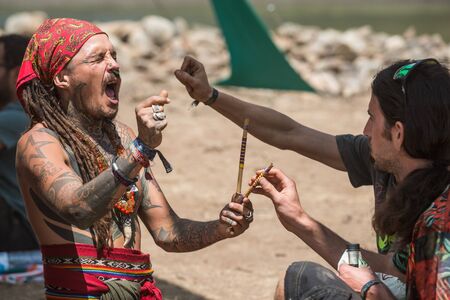 Two guys during a rape ceremony at the Lost Theory psytrance music festival, near Riomalo de Abajoのeditorial素材
