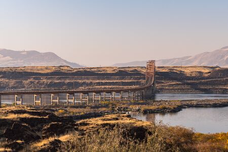 Sunset view of The Dalles bridge over the Columbia River that separates Washington and Oregon statesの写真素材