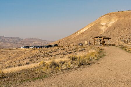 Tourists and cars parked at the beginning of a trail in Painted Hillのeditorial素材