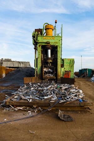Moros H-L500 scrap pressing machine in a scrap yard.のeditorial素材