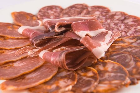 Assortment plate of sausages with ham, chorizo, salami and pork loin.の写真素材