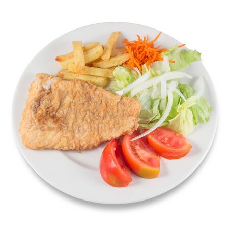 Plate of Roman style hake with chips and salad with lettuce, onion and tomato.の写真素材