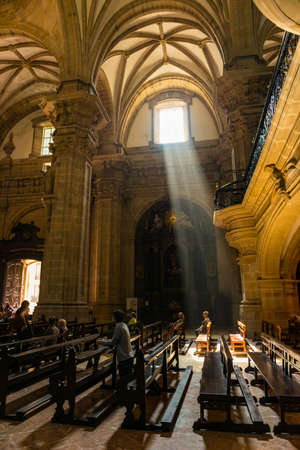 People praying in the pews of the church of Santa Maria , Gipuzkoaのeditorial素材