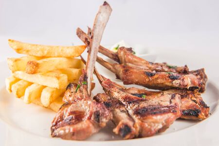 Lamb chops with rosemary and chipsの写真素材