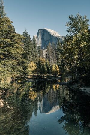 View of the Half Dome and the Merced River from the Sentinel Bridge in Yosemite National Parkの写真素材