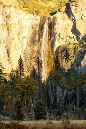 Rainbow light diffraction at the top of the Bridalveil Fall in Yosemite National Park, California, USAの写真素材