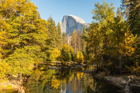 View of the Half Dome and the Merced River from the Sentinel Bridge in Yosemite National Parkの写真素材