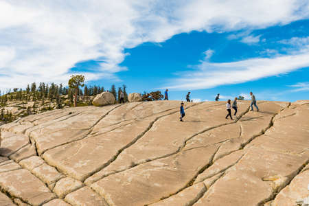 A group of tourists on the Olmsted Point granite hills in Yosemite National Park, California, USAのeditorial素材