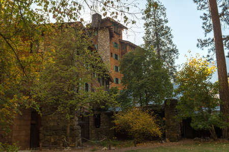 View of The Ahwahnee Hotel among the trees in Yosemite National Parkのeditorial素材