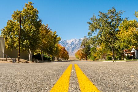View of an empty street with Black Mountain in the background in Independence, California, USAの写真素材