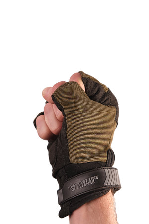 tactical military glove without fingers olive for hand protection. Dressed on the arm. The fingers are folded into a fistの写真素材