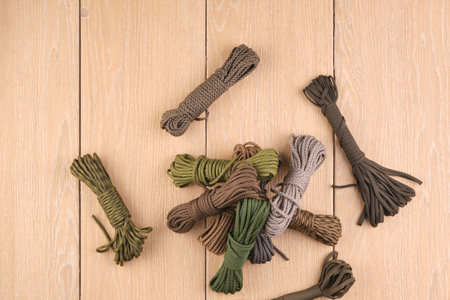 cord strong paracord tactical, tourist 550, different color, on wood-tileの写真素材